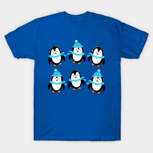 Festive Winter Penguins with Blue Scarves and Hats on a Dark Blue Backdrop, made by EndlessEmporium T-Shirt